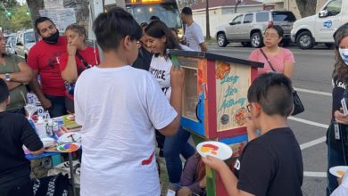 Children help paint the little library, which was designed by PSL member Naomi Powers, and features designs of Anthony, his favorite soccer team Club Universidad Nacional, flowers and the text “Long Live Anthony.” Liberation photo