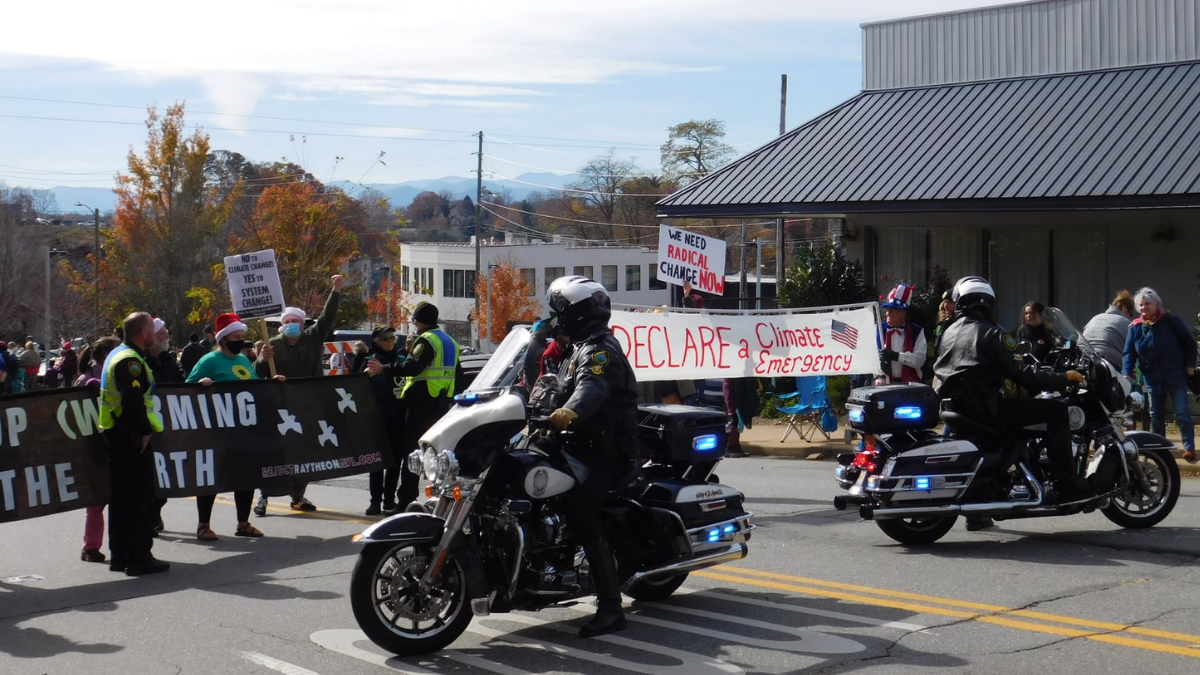 Activists bring message of climate justice to Asheville Holiday Parade