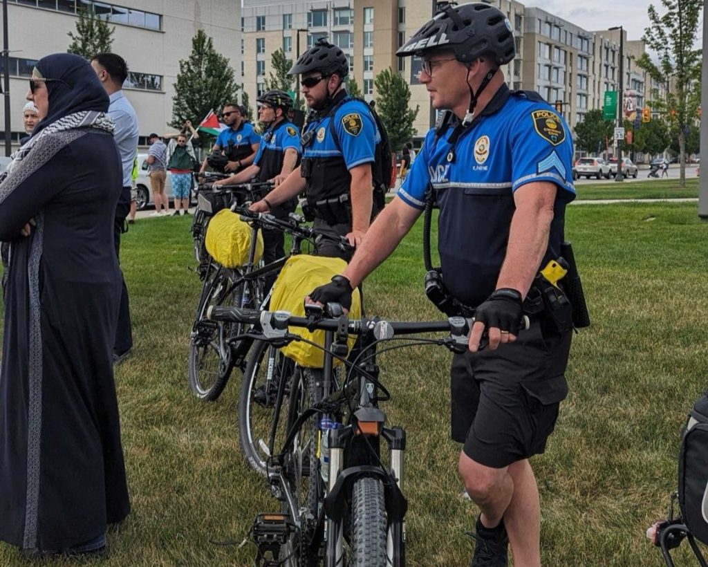 Cleveland Clinic police use bikes to clear demonstrators from the lawn in front of the Cleveland Clinic’s Samson Pavilion. Liberation photo