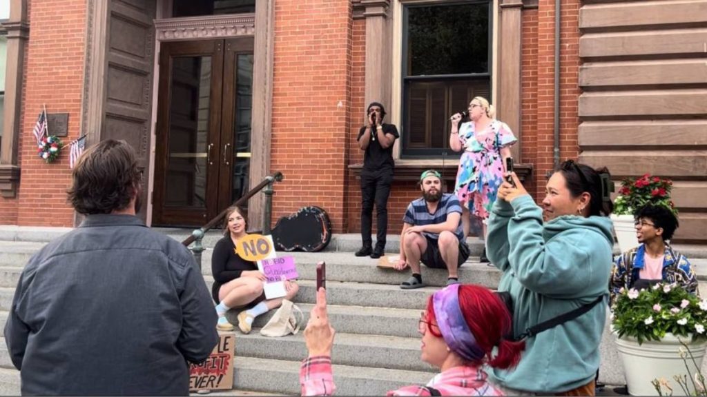 New Bedford community members rally outside City Hall on July 22 to celebrate defeat of the BID proposal. Liberation Photo: Dave Pimentel